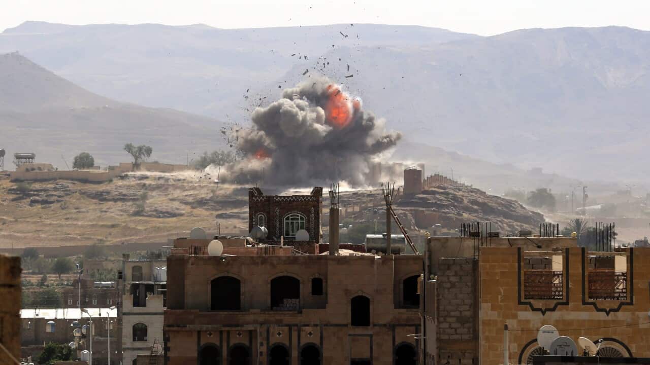 Smoke and balls of fire rise from an alleged Houthi-held military position after it was hit by a Saudi-led air strike in Sana'a, Yemen, 25 September 2016.