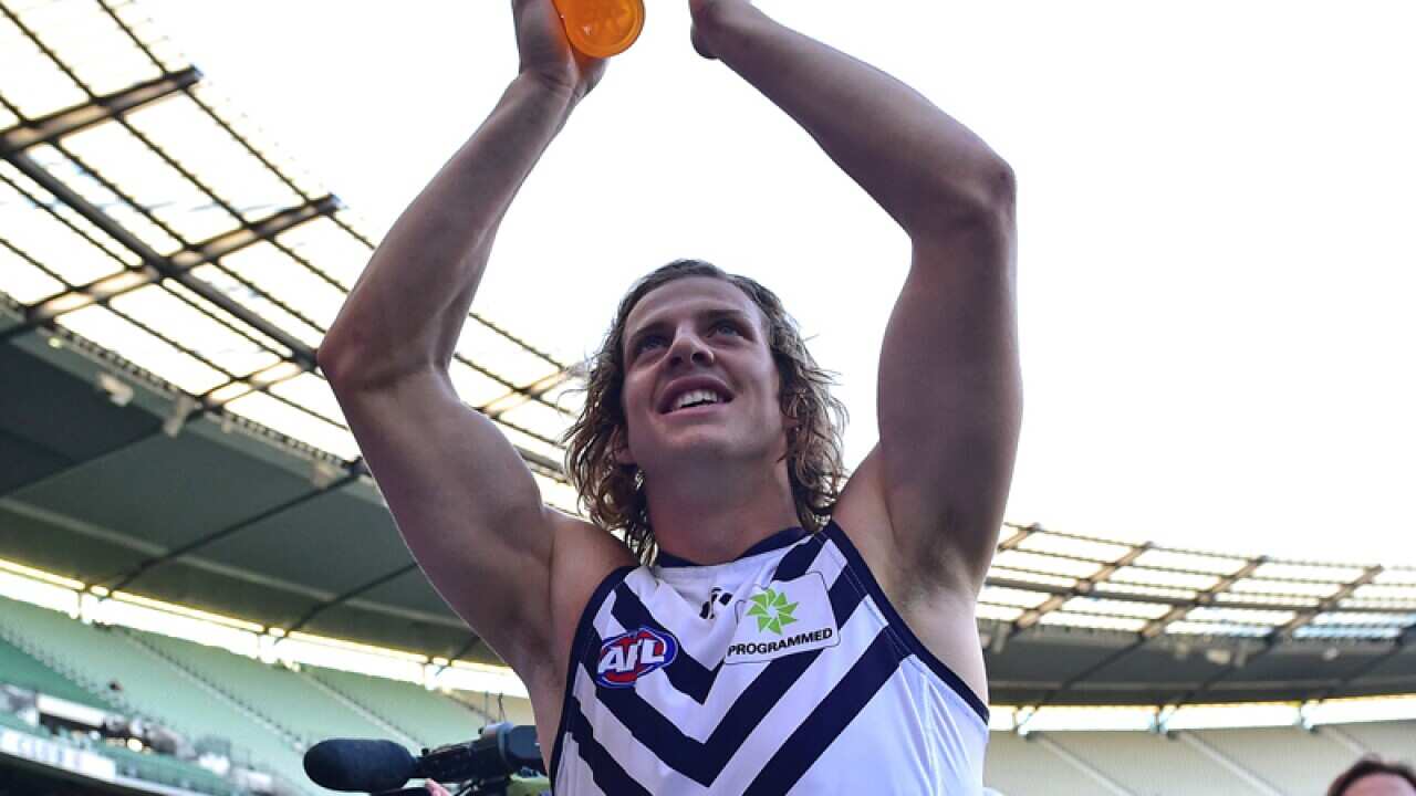 Fremantle Dockers player Nat Fyfe celebrates.