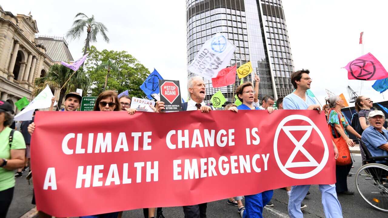 Extinction Rebellion protesters demonstrate outside the Queensland Parliament House in Brisbane, Tuesday, February 4, 2020. (AAP Image/Dan Peled) NO ARCHIVING