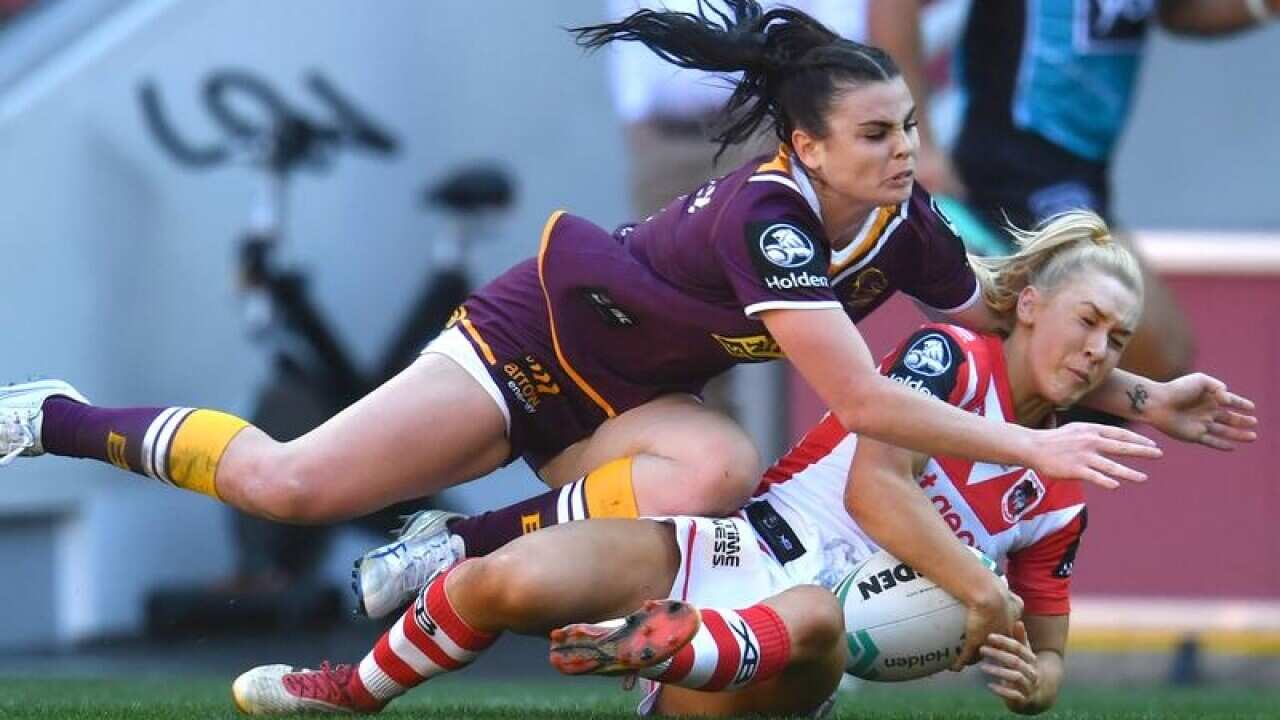 Broncos' Amber Pilley tackles Rikeya Horne of the Dragons.