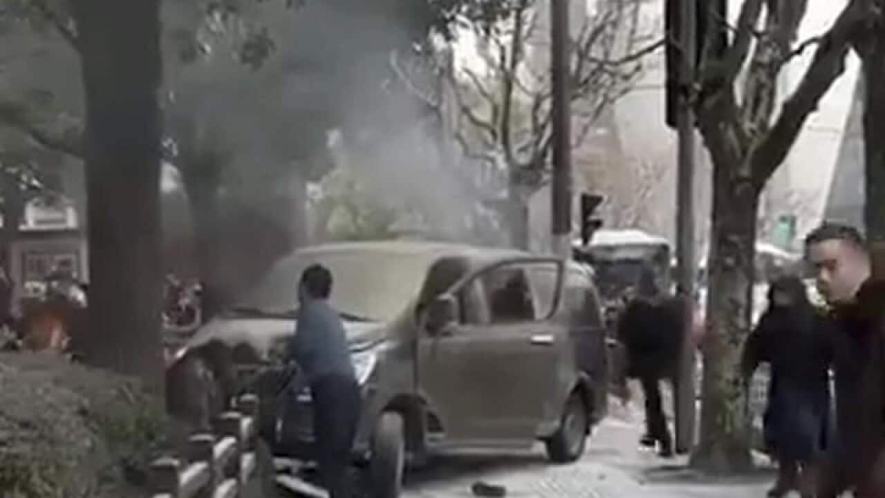 A screenshot of a minivan involved in an accident in Shanghai