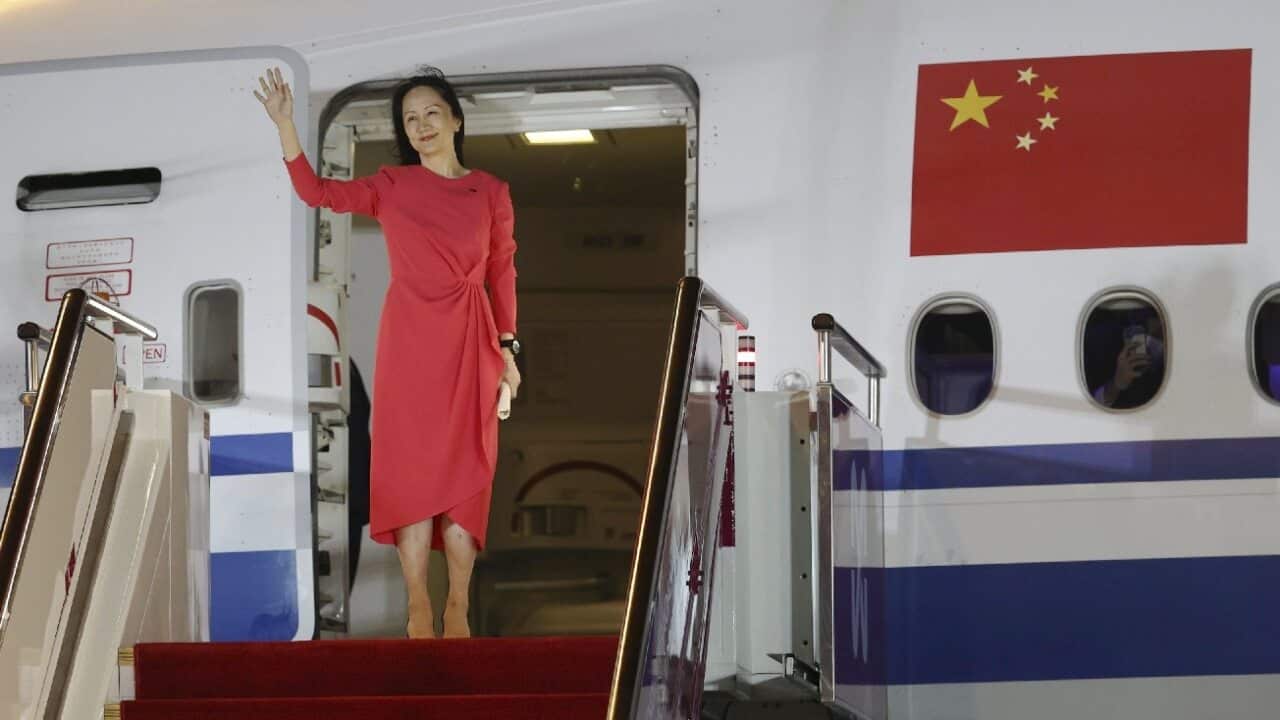 Huawei CFO Meng Wanzhou disembarks from a plane upon her arrival at Shenzhen Bao'an International Airport.