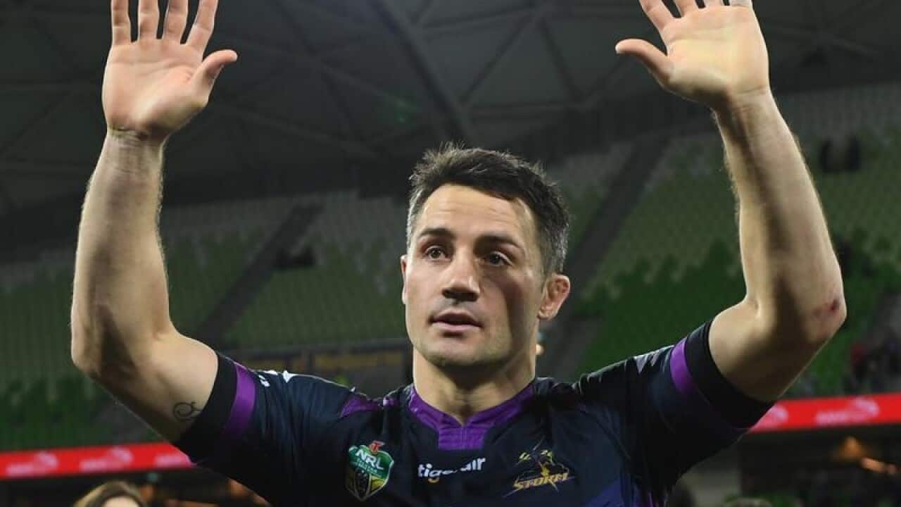 Cooper Cronk of the Storm acknowledges fans