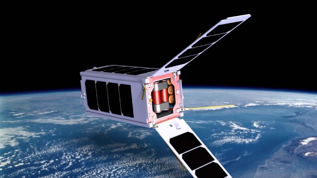 Artists Impression of a Cubesat orbiting the earth, showing expanded solar panel arrays