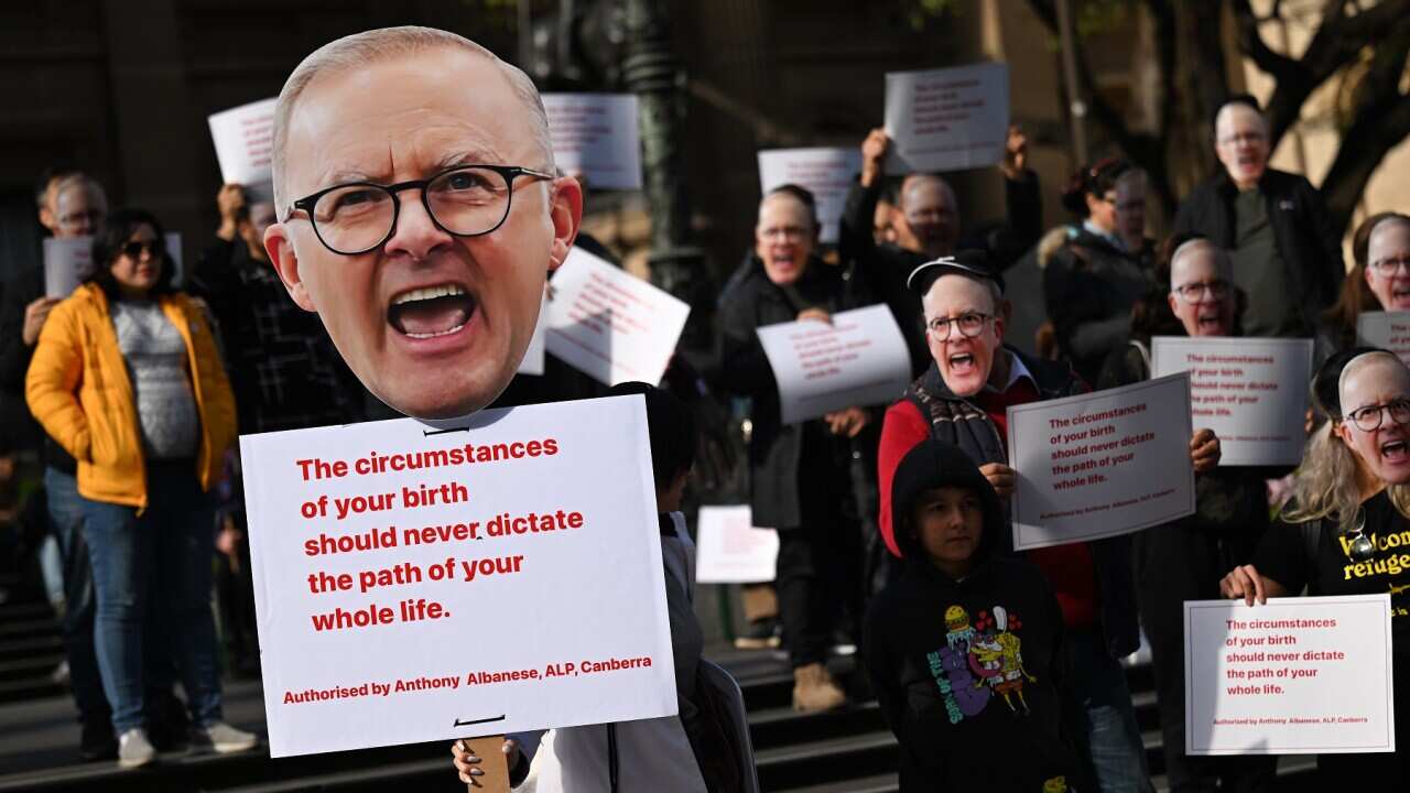 People participate in a protest against offshore detention at the State Library of Victoria in Melbourne