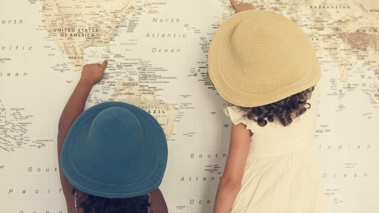 Two girl looking at map