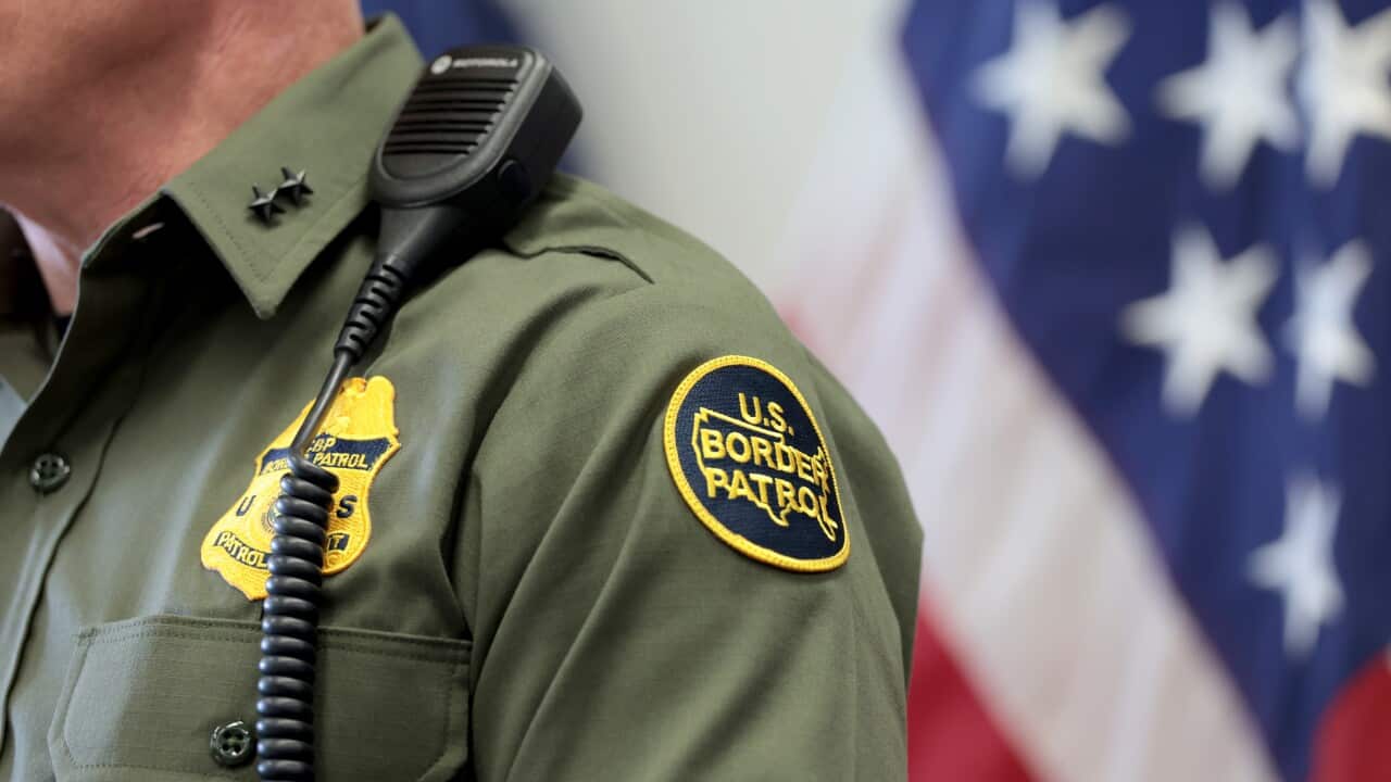A close-up of the uniform of a US border patrol agent.