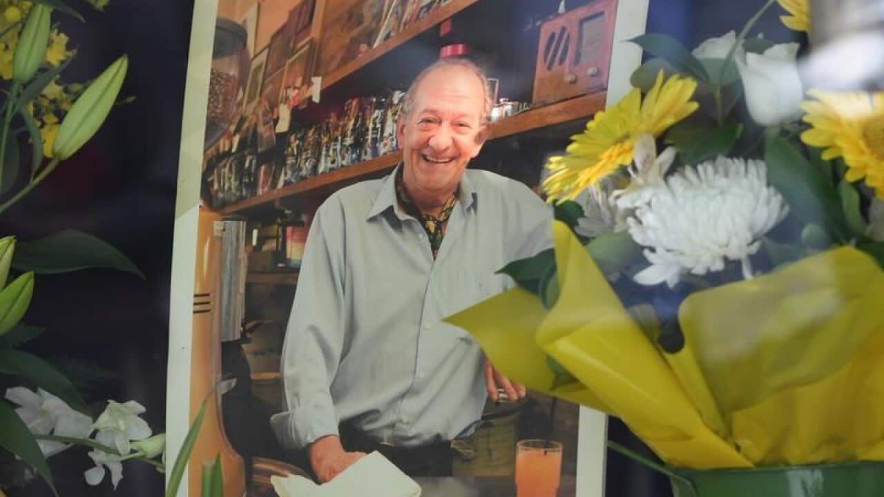 A mural for Sisto Malaspina is seen outside Pellegrini's Espresso Bar.