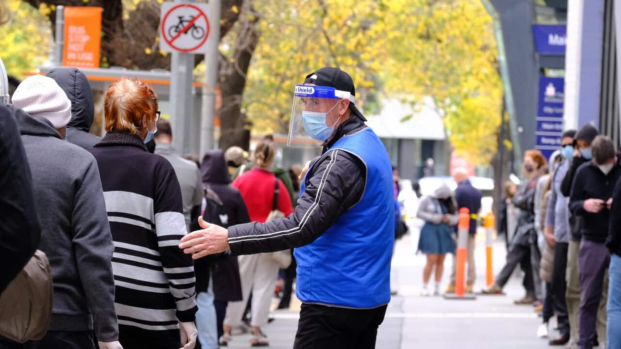 People line up to get tested for Covid-19 outside the Royal Melbourne Hospital in Melbourne, Tuesday, May 25, 2021. (AAP Image/Luis Ascui) NO ARCHIVING