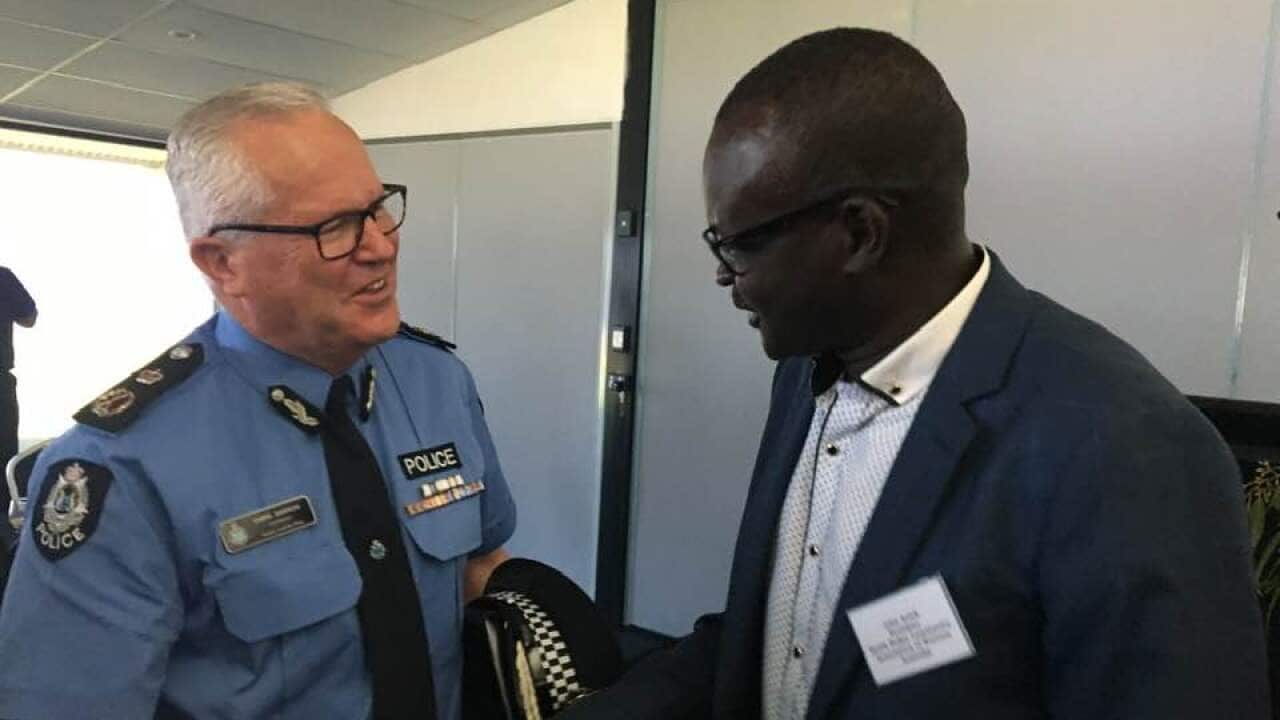 A south Sudanese community leader Akuot Achiek Akuot with WA Police Commissioner Mr Chris Dawson APM
