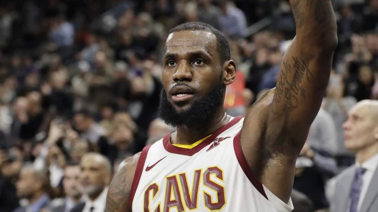 LeBron James (23) acknowledges cheering fans.