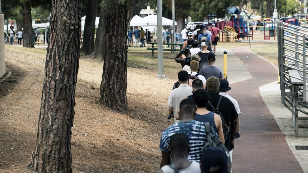 People lining up for the monkeypox vaccine.