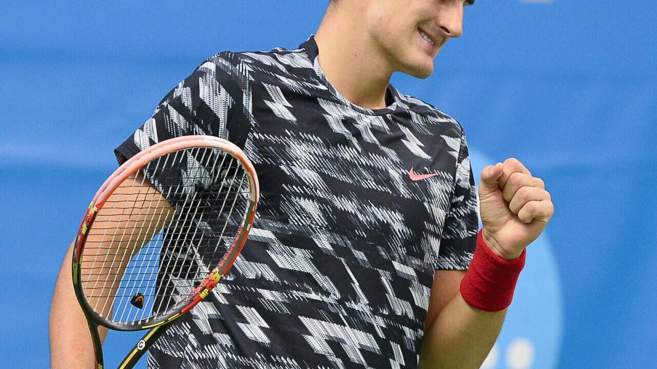 Bernard Tomic clenches his fist after winning a point against Spain's Fernando Verdasco (Getty)