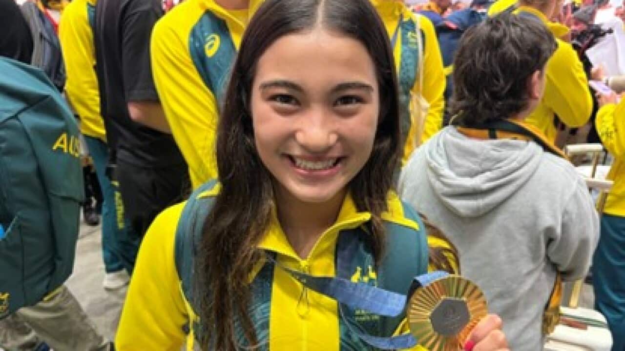 Women's skateboarding park gold medallist Arisa Trew at Sydney Airport in Mascot, Sydney (AAP).jpg