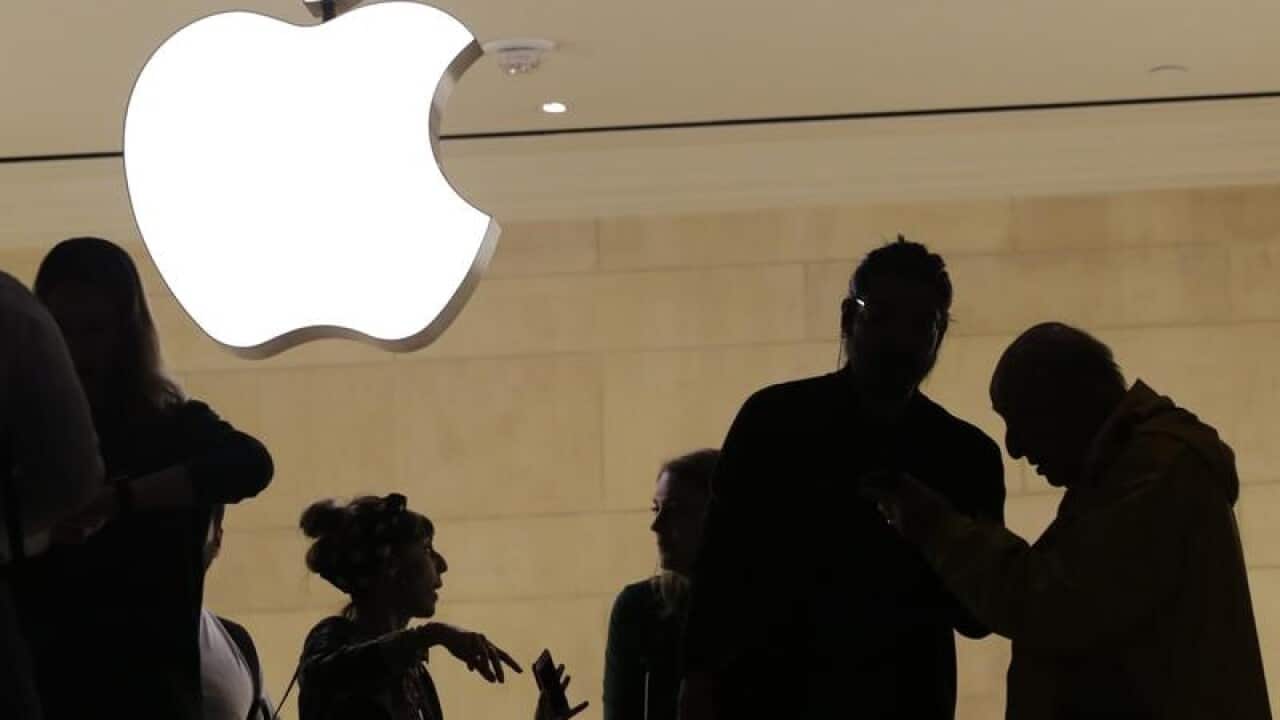 A file image of customers in an Apple store