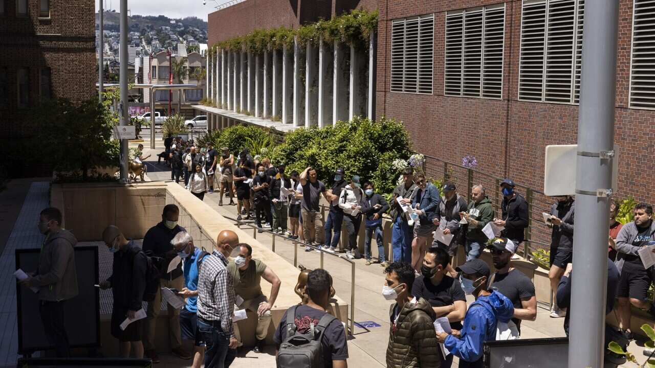 People standing in long lines