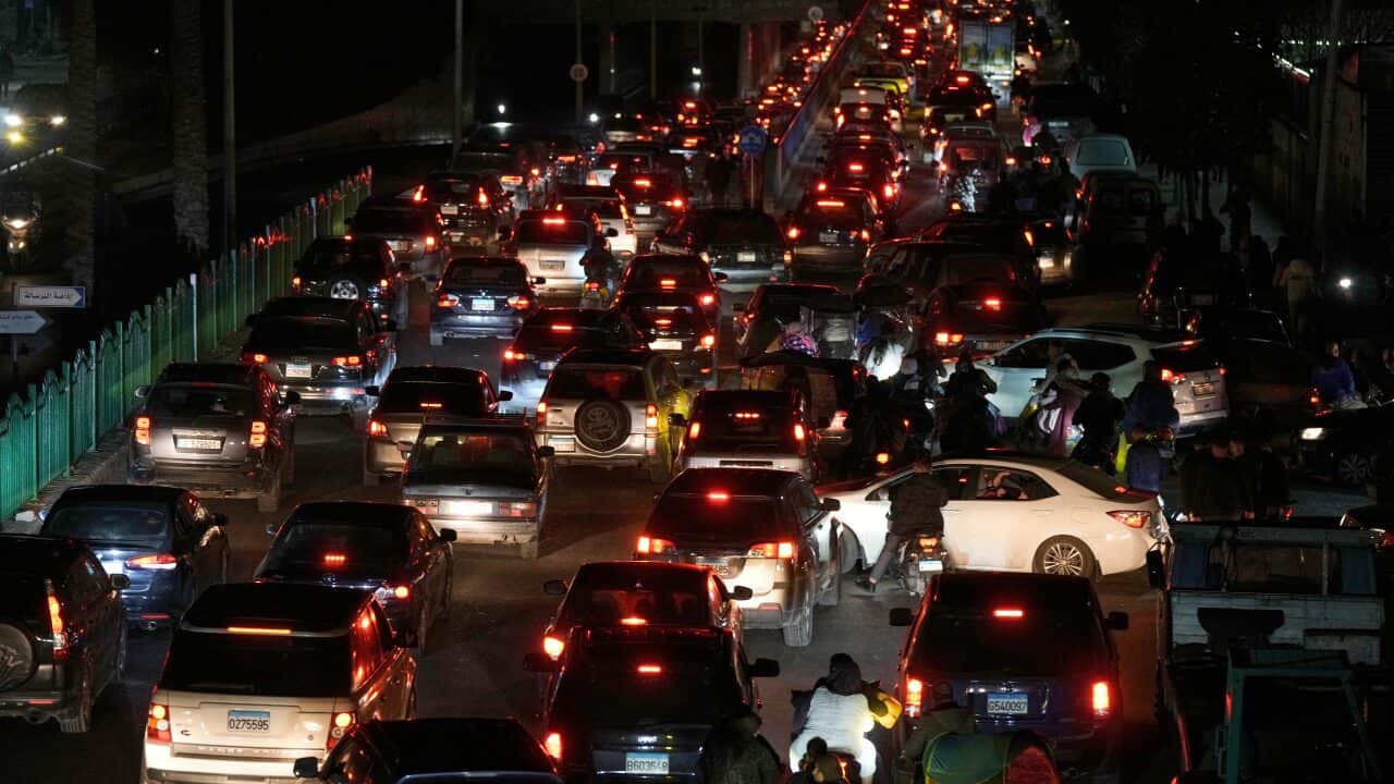 A road filled with cars in traffic.