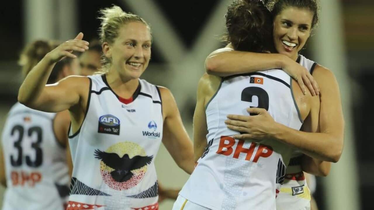 Adelaide Crows players celebrate