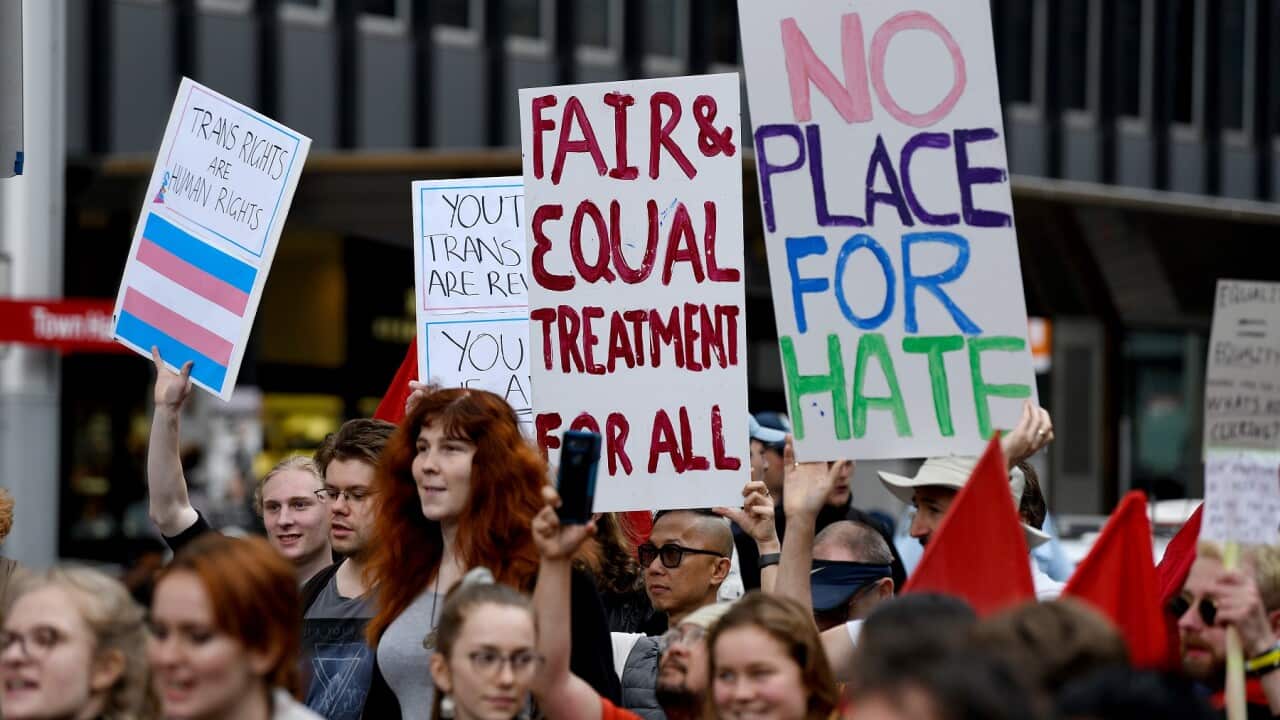 Protestors holding placards are seen during a rally to protest against the Religious Discrimination Bill at Sydney Town Hall in Sydney, Saturday, October 12, 2019. (AAP Image/Bianca De Marchi) NO ARCHIVING