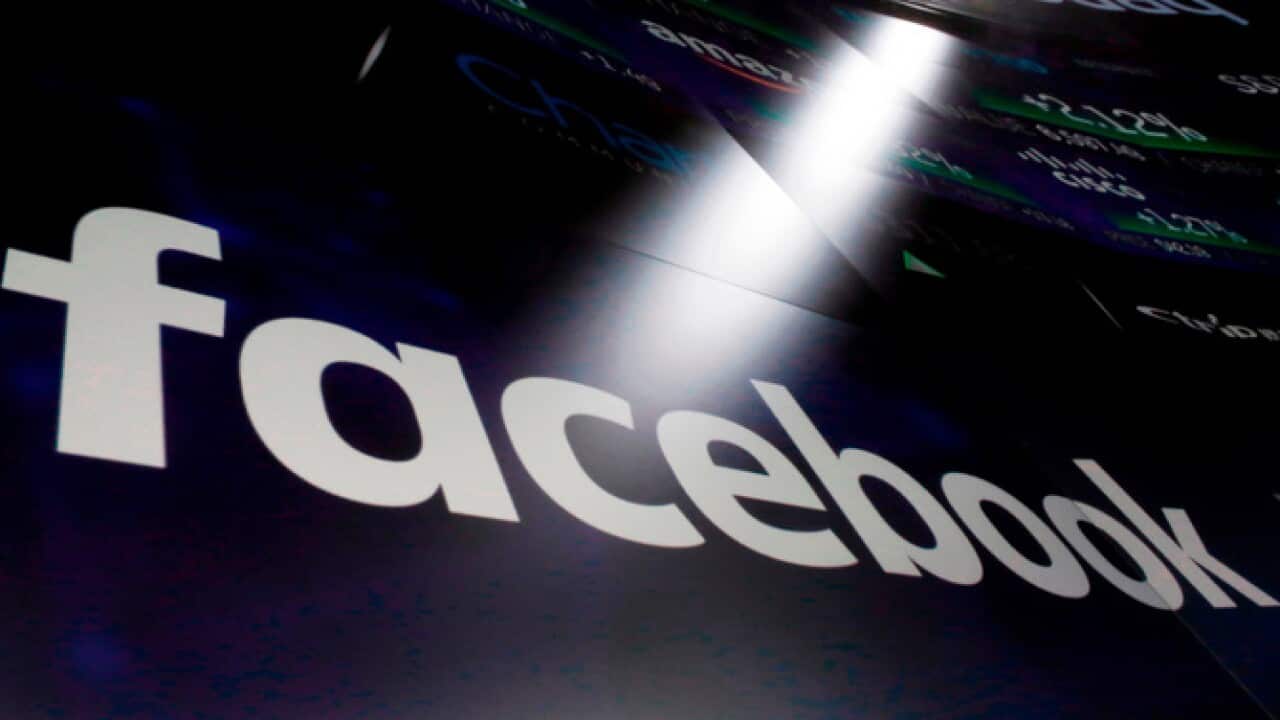 The logo for Facebook appears on screens at the Nasdaq MarketSite