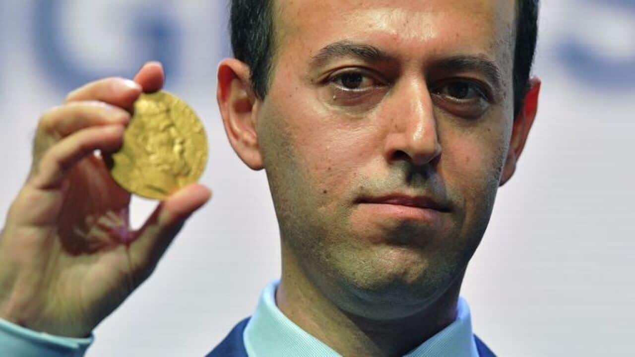 Kurdish refugee turned Cambridge University professor, Caucher Birkar, with his Fields Medal for Mathematics