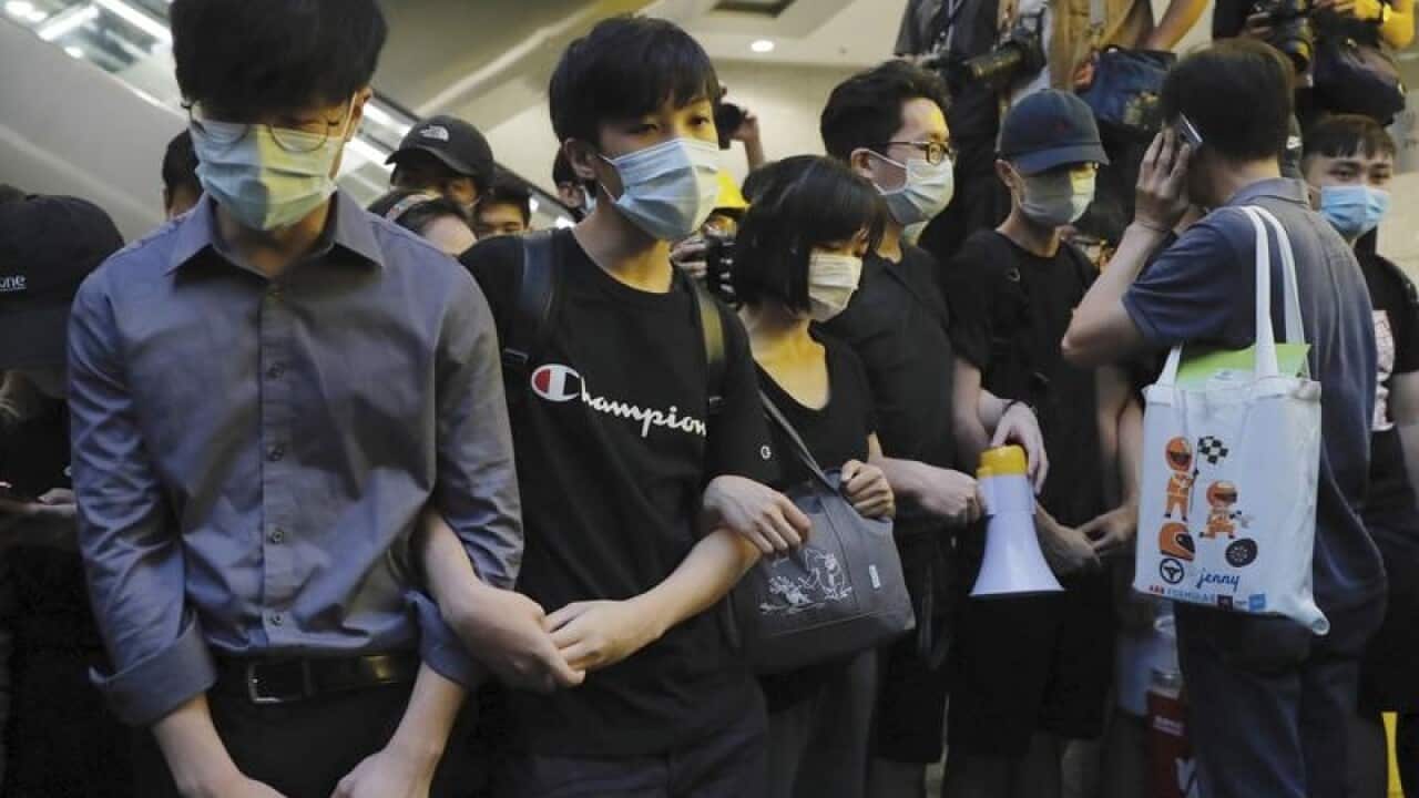 Protesters block the lobby of the Hong Kong Revenue Tower.