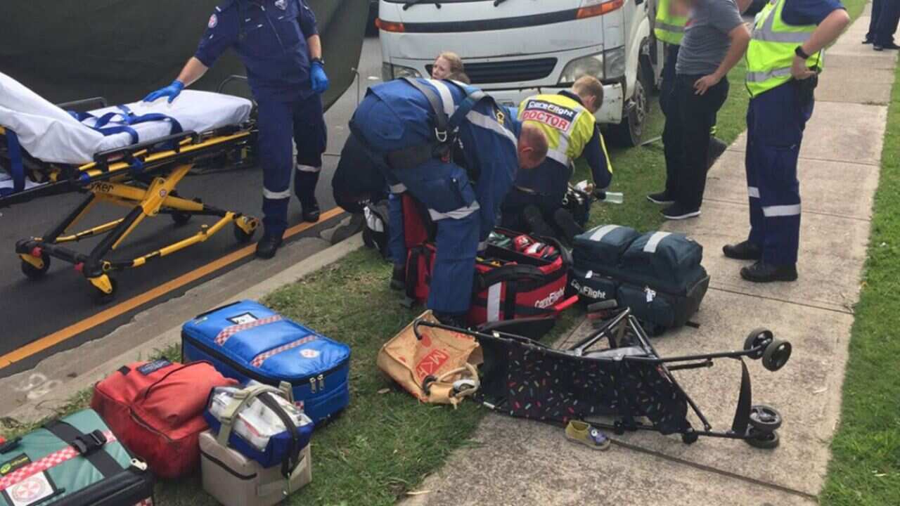 A toddler has been rushed to hospital after being hit by a truck in Sydney.