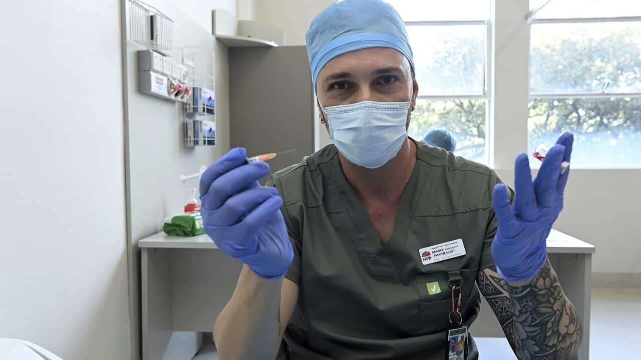 Pharmacist Blanko Radojkovic prepares a simulated vaccine at the Sydney Local Health District Vaccination Hub