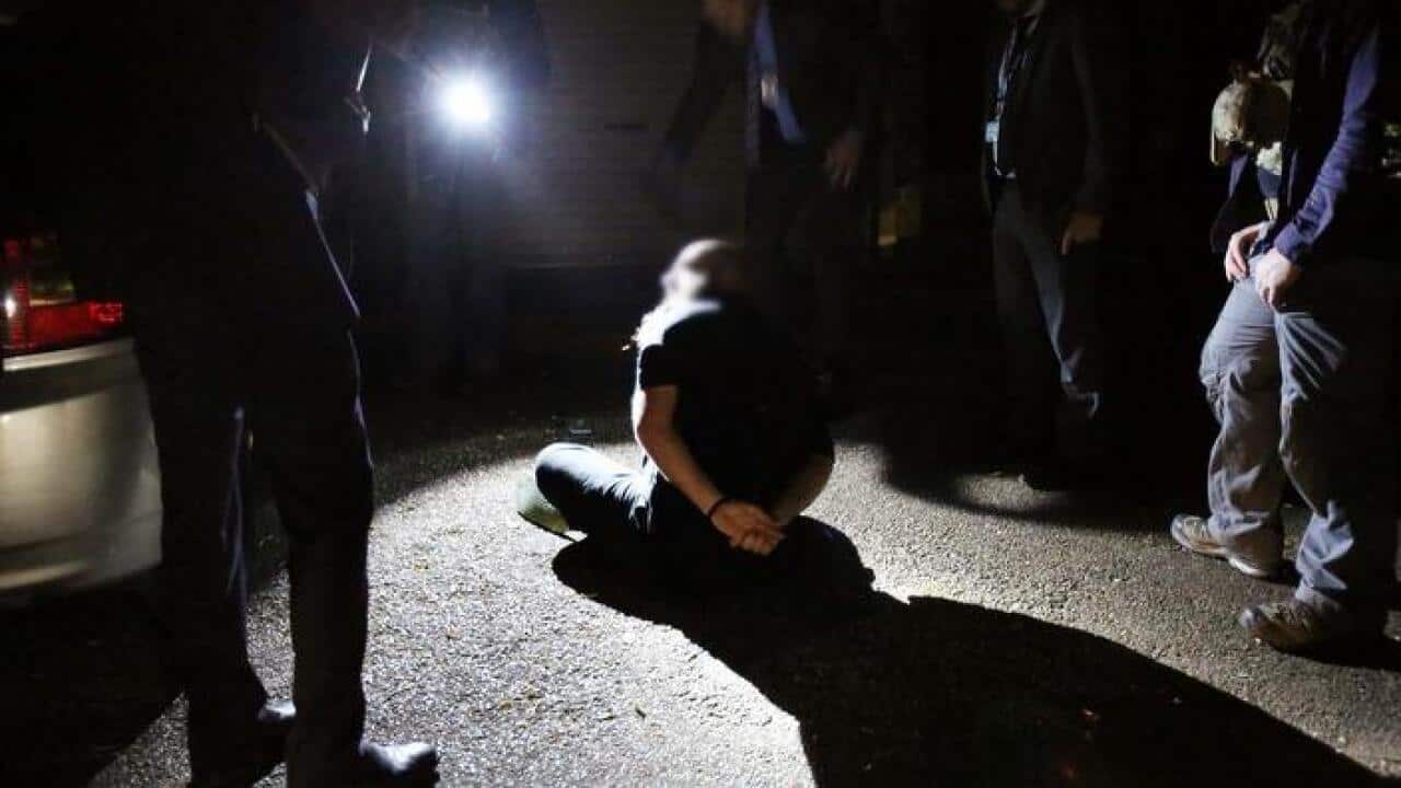 A supplied image of NSW Police during a raid at Marsfield in Sydney's west