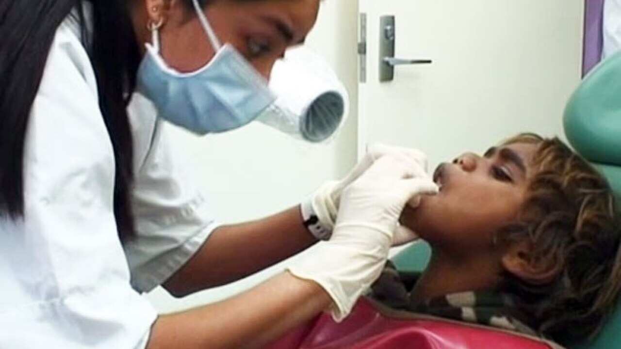 A child visits the dentist.