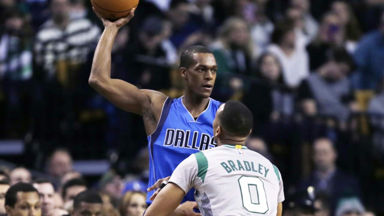 Dallas Mavericks guard Rajon Rondo (left)