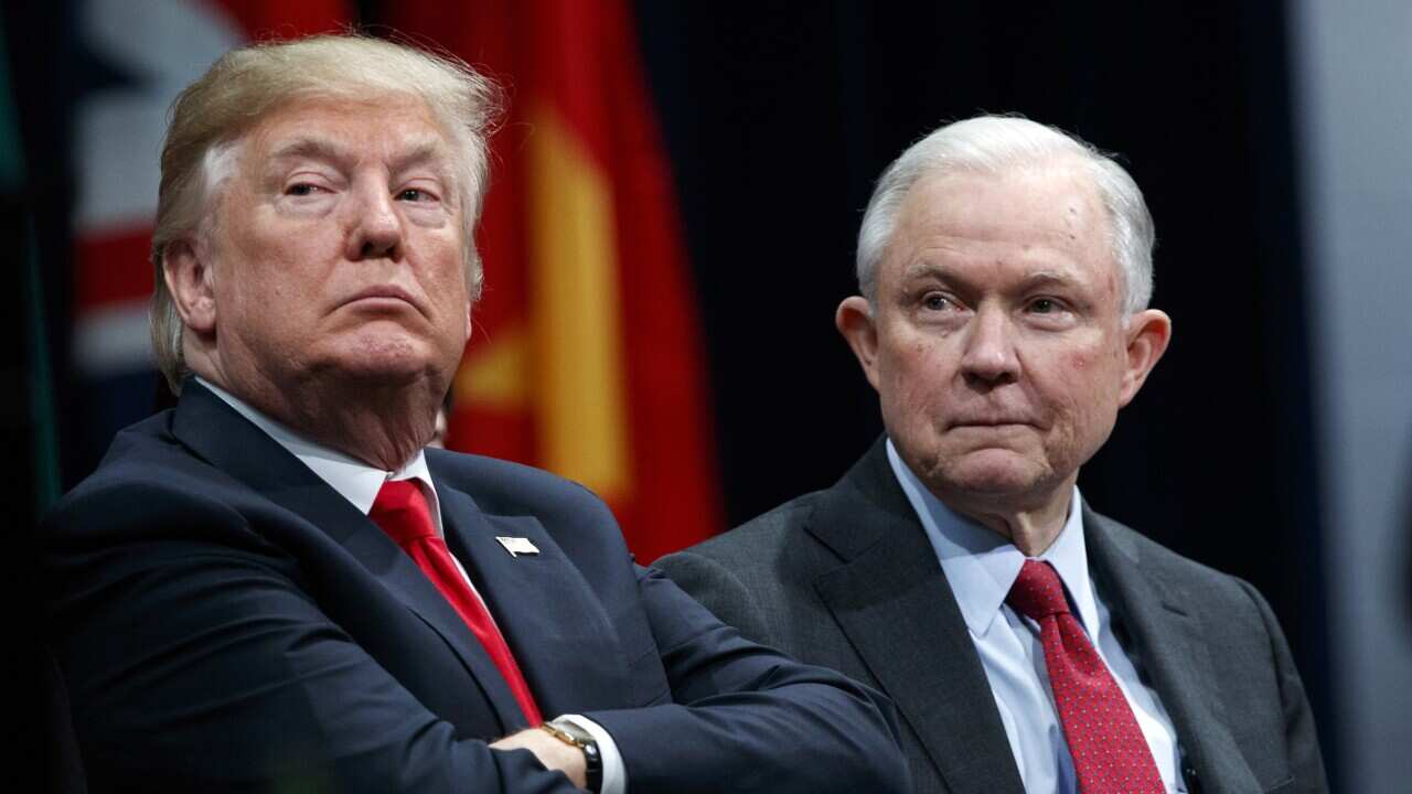 President Donald Trump, left, appears with Attorney General Jeff Sessions