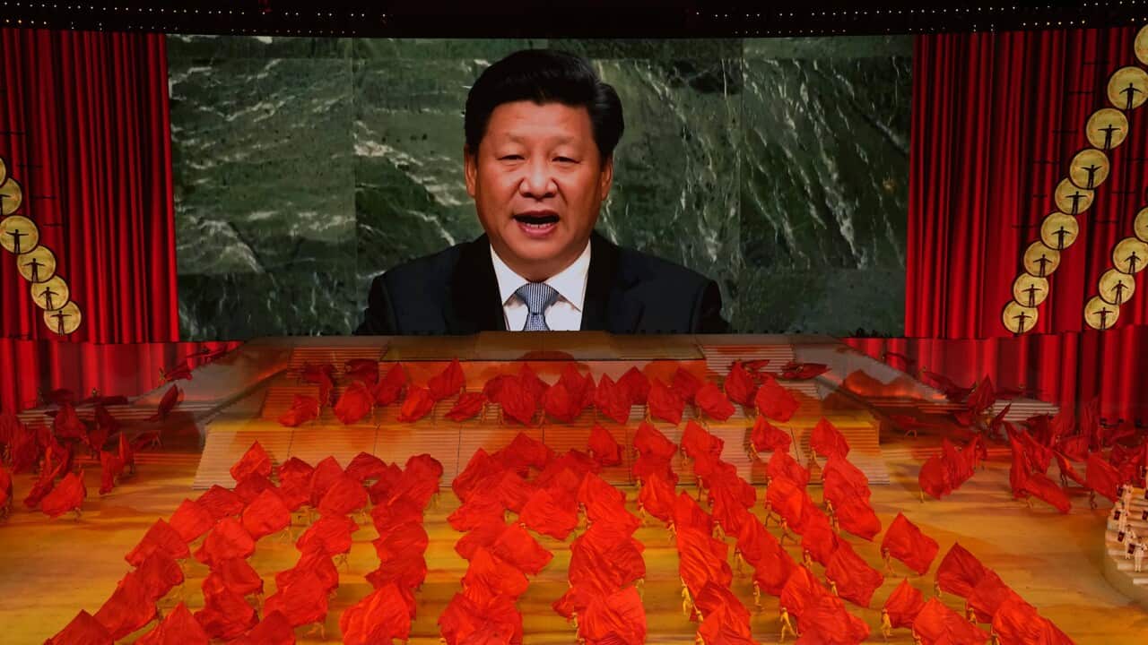 Chinese President Xi Jinping displayed on a screen (AAP).jpg