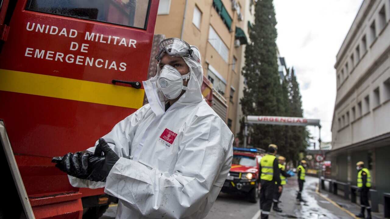A member of the UME (Emergency Army Unit) doing disinfection work in Spain