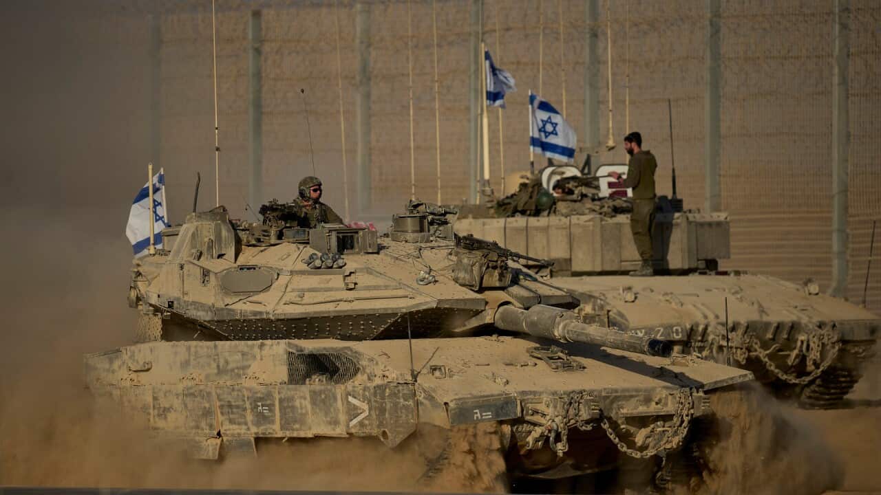 Israeli tanks move along the Israeli-Gaza border (AAP)
