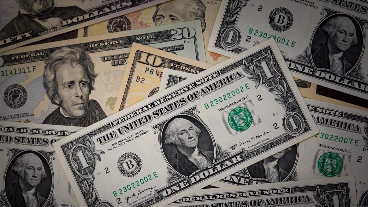 US dollars are displayed on a table in China - 15 Sep 2024