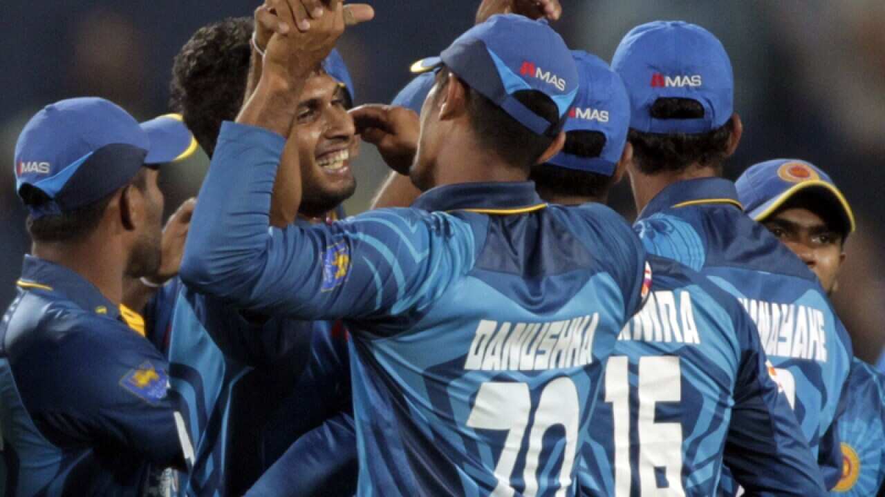 Sri Lanka cricket player Dasun Shanaka celebrates with teammates