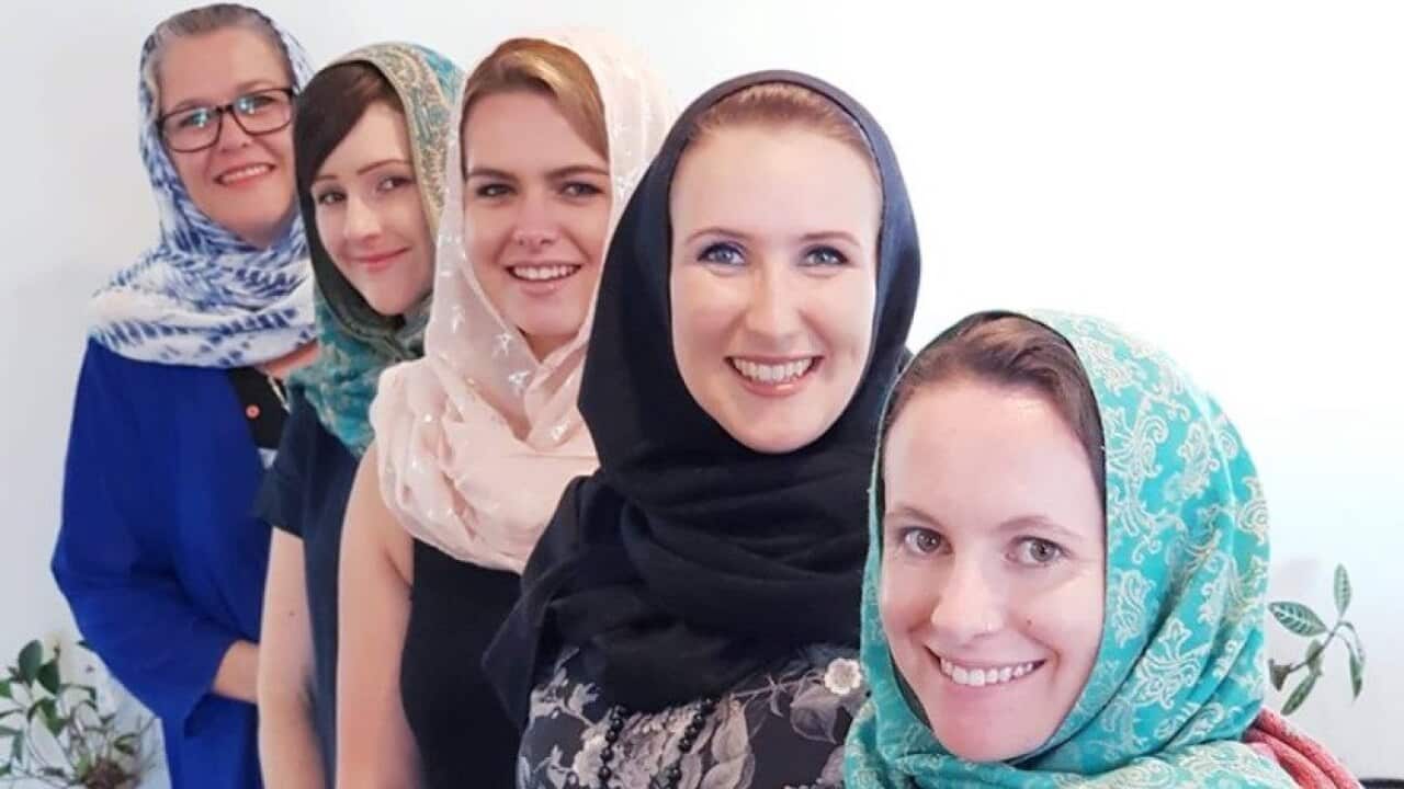 New Zealanders are wearing headscarves in a show of solidarity.