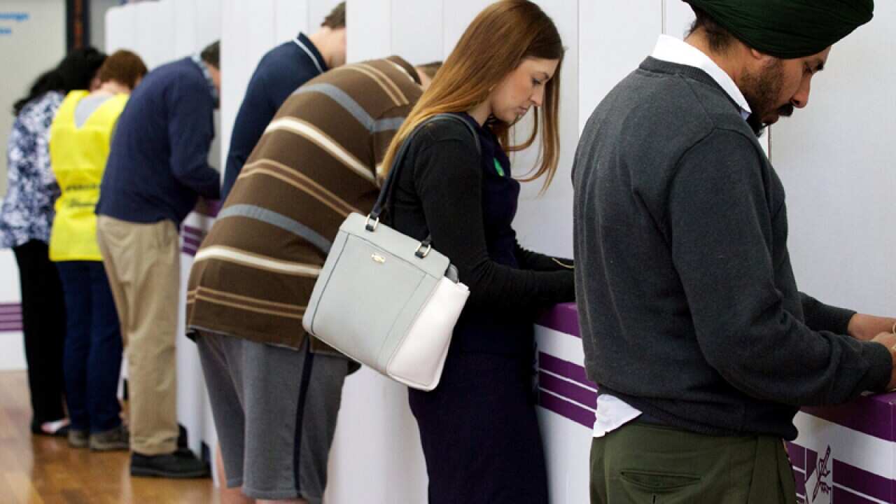 Members of the public casting their vote at Kelmscott High School