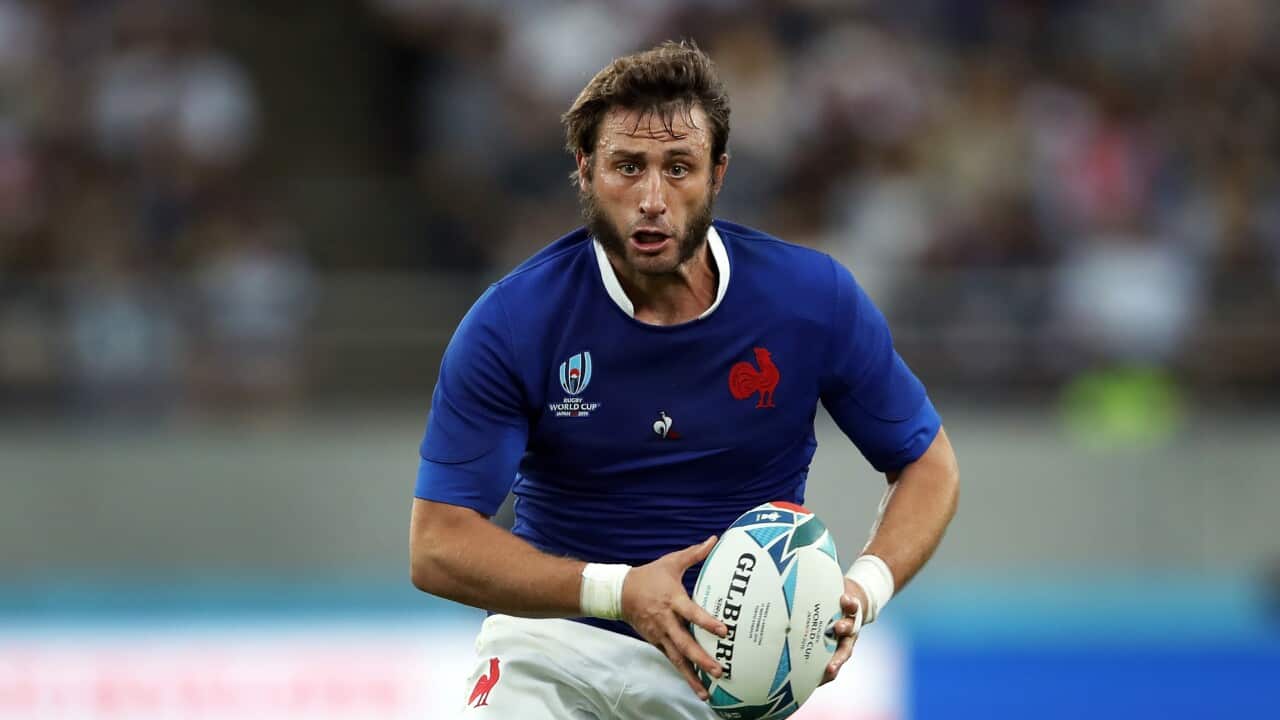 France's Maxime Medard runs during the Rugby World Cup Pool C game at Tokyo Stadium between France and Argentina in Tokyo, Japan, Saturday, Sept. 21, 2019. (AP Photo/Christophe Ena)