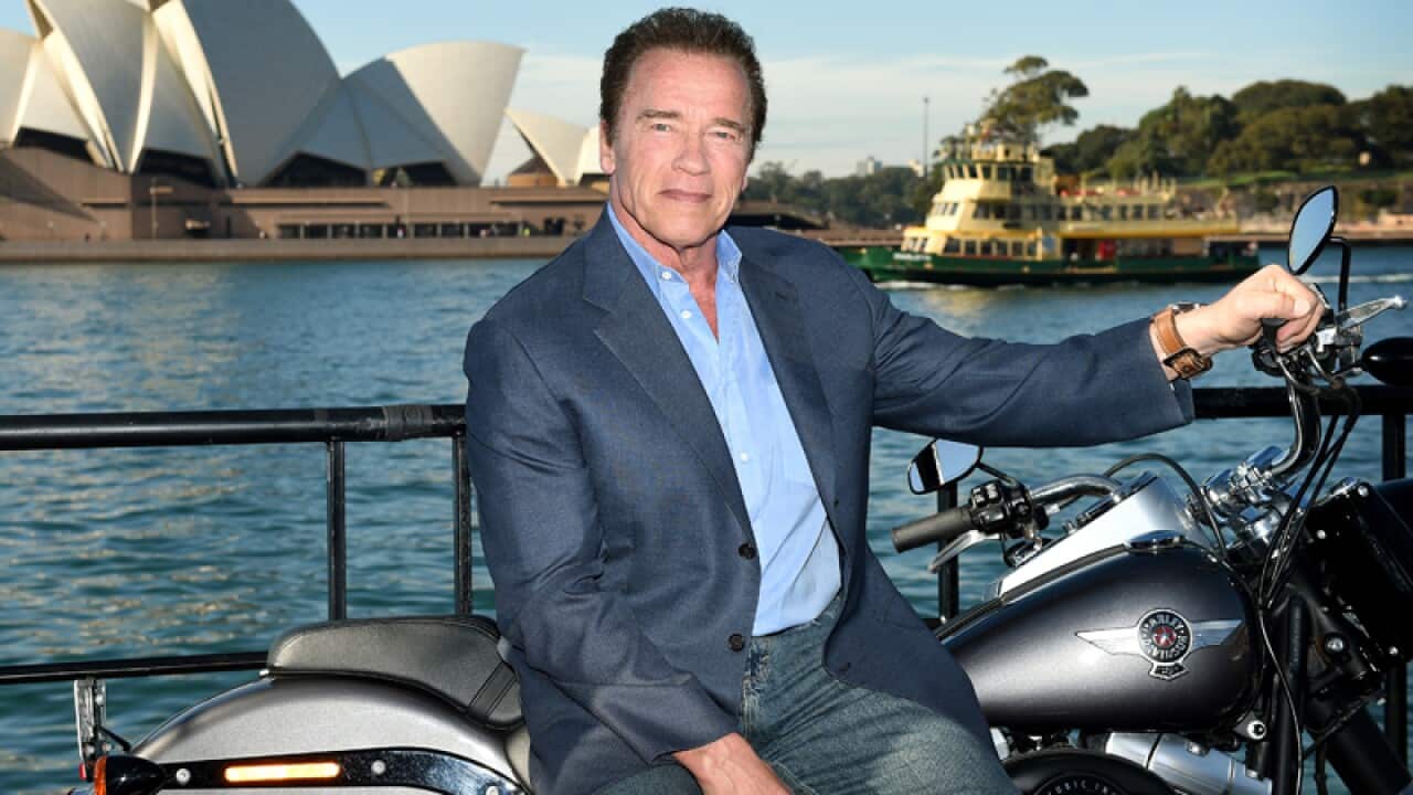 Arnold Schwarzenegger poses for a photograph in Sydney