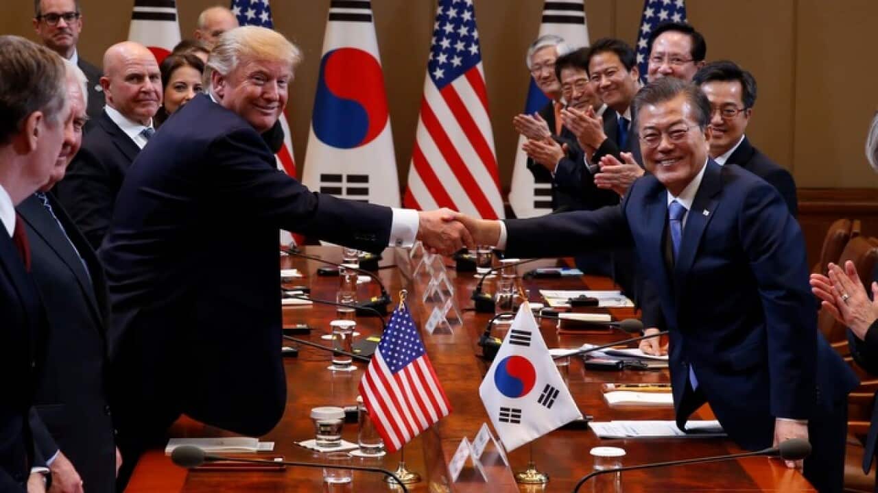 US President Donald J. Trump and South Korean President Moon Jae-in shake hands.