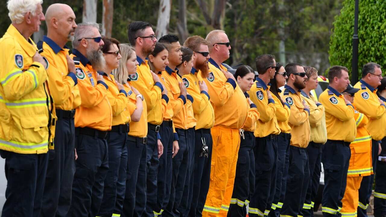 NSW RFS volunteers make an honour guard for Andrew O'Dwyer, a firefighter who died while battling a blaze in December.