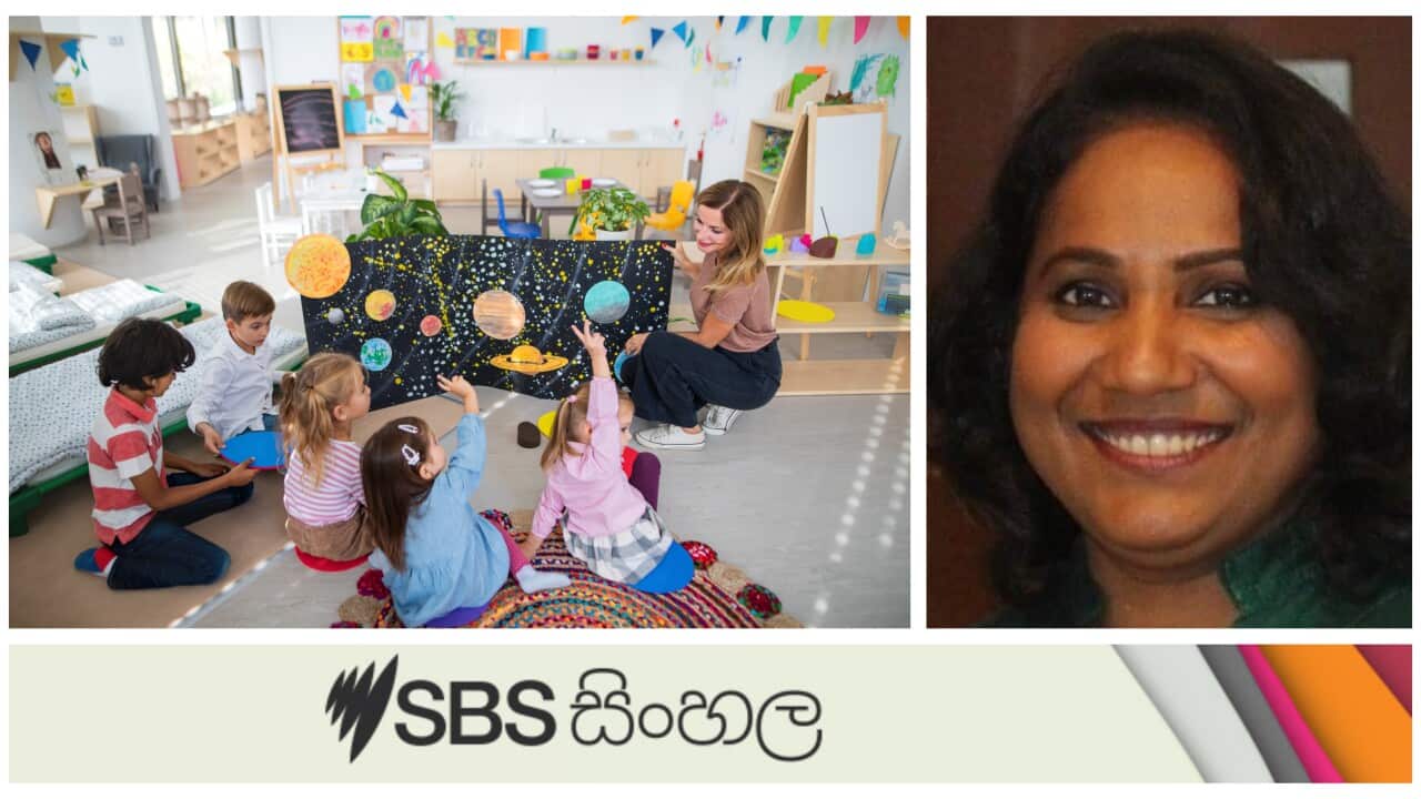 High angle view of preschool teacher showing poster with planets to children indoors in nursery, Montessori education.