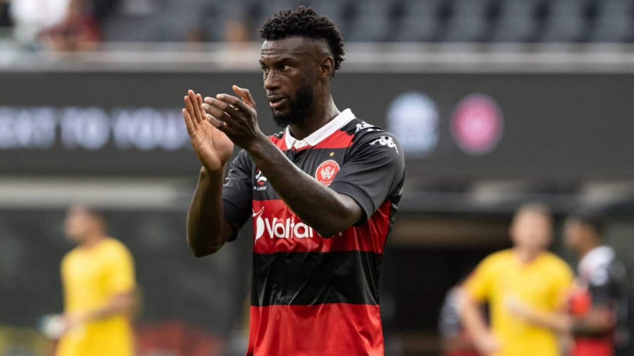 Bernie Ibini applauds supporters after a Western Sydney Wanderers match