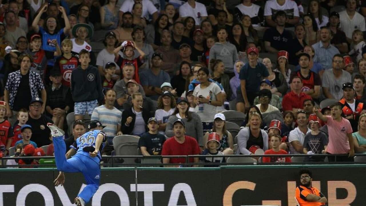 Ben Laughlin of the Strikers throws a catch