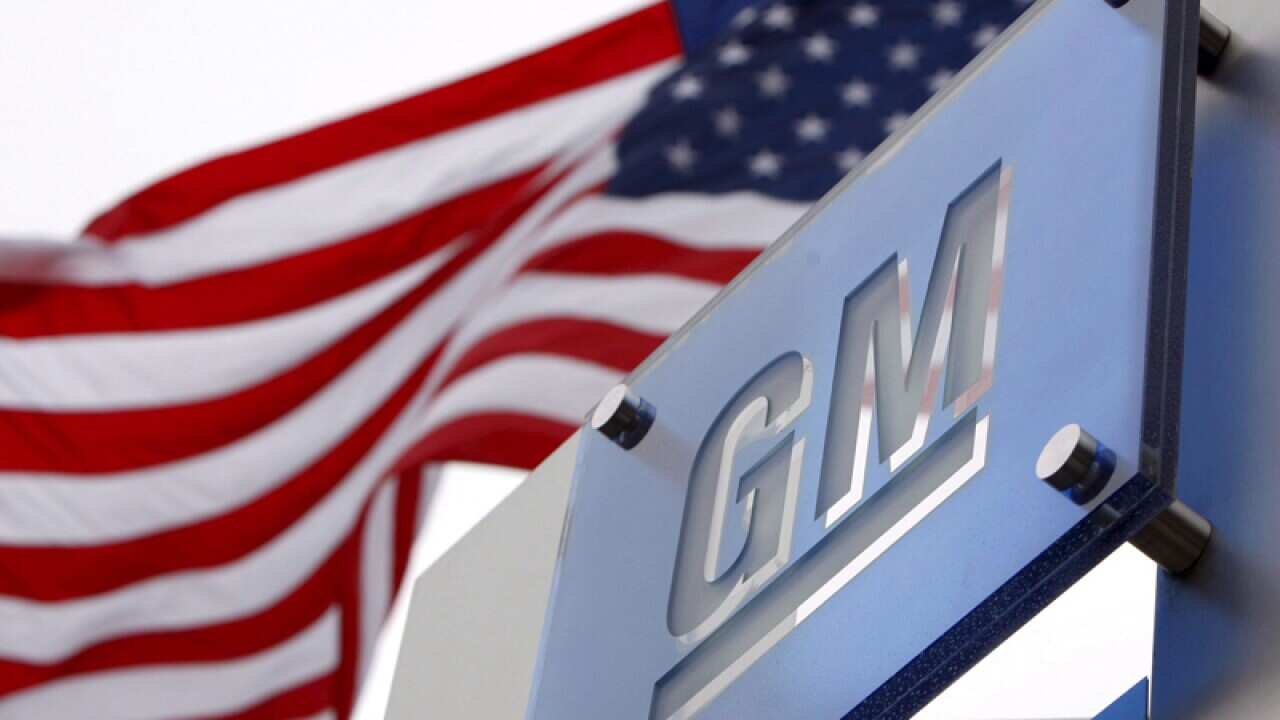 Flags fly outside a General Motors headquarters