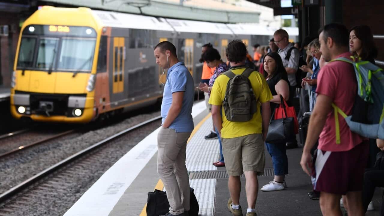 Commuters stand on a platform at a Sydney train station in Sydney, Thursday, January 25, 2018.