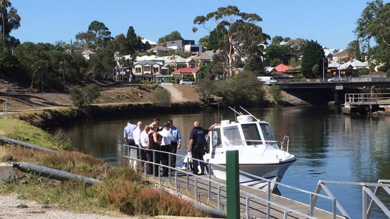 Detectives search a Melbourne river for body parts