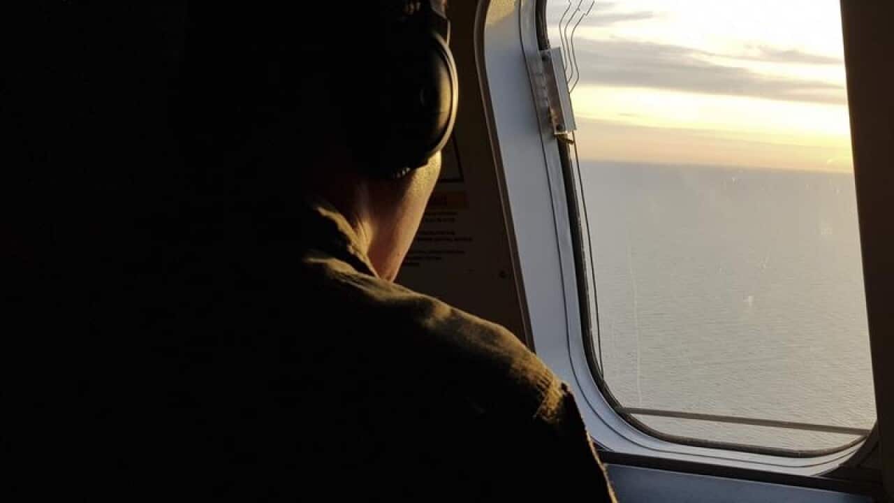 Argentine Navy Captain Roman Olivero looks at the sea